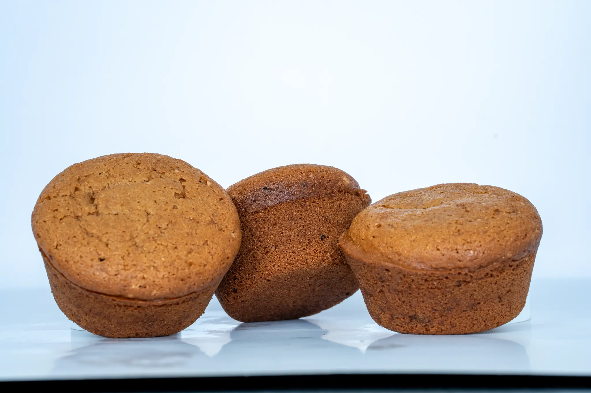 Three freshly baked banana muffins