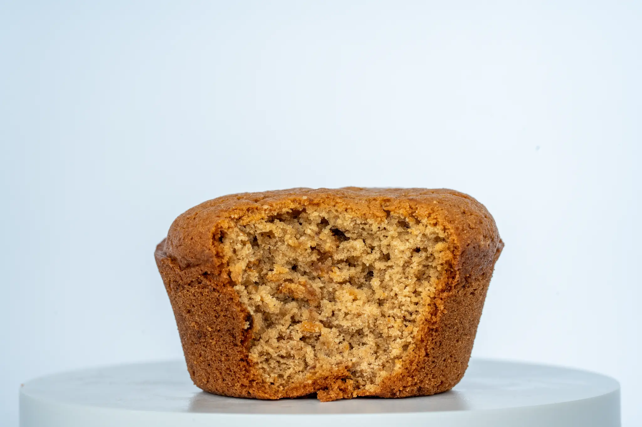 Cross-section of a banana muffin showing moist fluffy interior